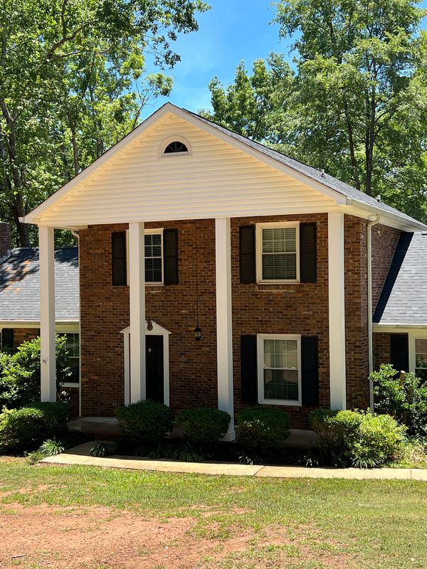 Clean home exterior after professional soft washing in Jones County GA