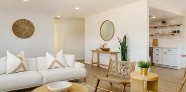Bright living room with neutral tones and natural wood accents.