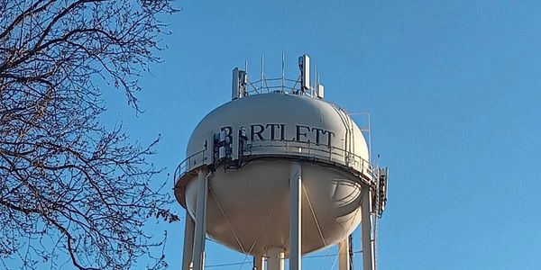 The Bartlett, TN water tower near local neighborhoods, highlighting the area’s small‑town charm.