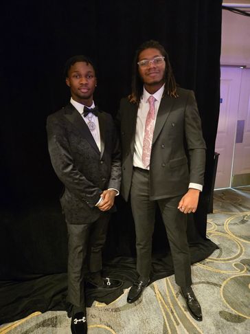 Marvin Robinson Jr. and Donte' Woods Jr. attending the 2025 Men of Honor Gala