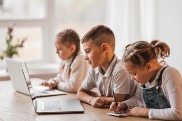 Children using laptops at home laptops2kids