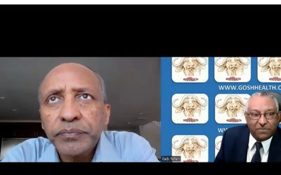 Two men in a video conference with medical diagrams in the background.