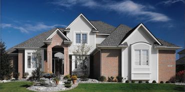 Modern custom home exterior with distinctive lines by Kraus Design Build and Kraus Plans