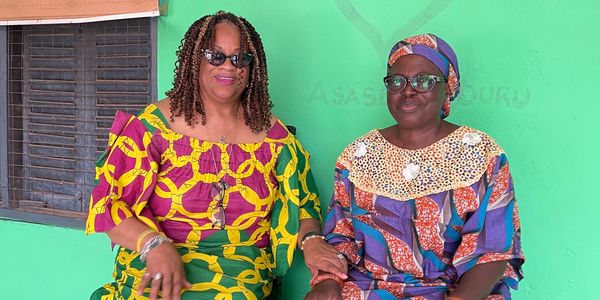 Two beautiful African woman wearing traditional cloths