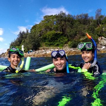 Family snorkelling at Manly