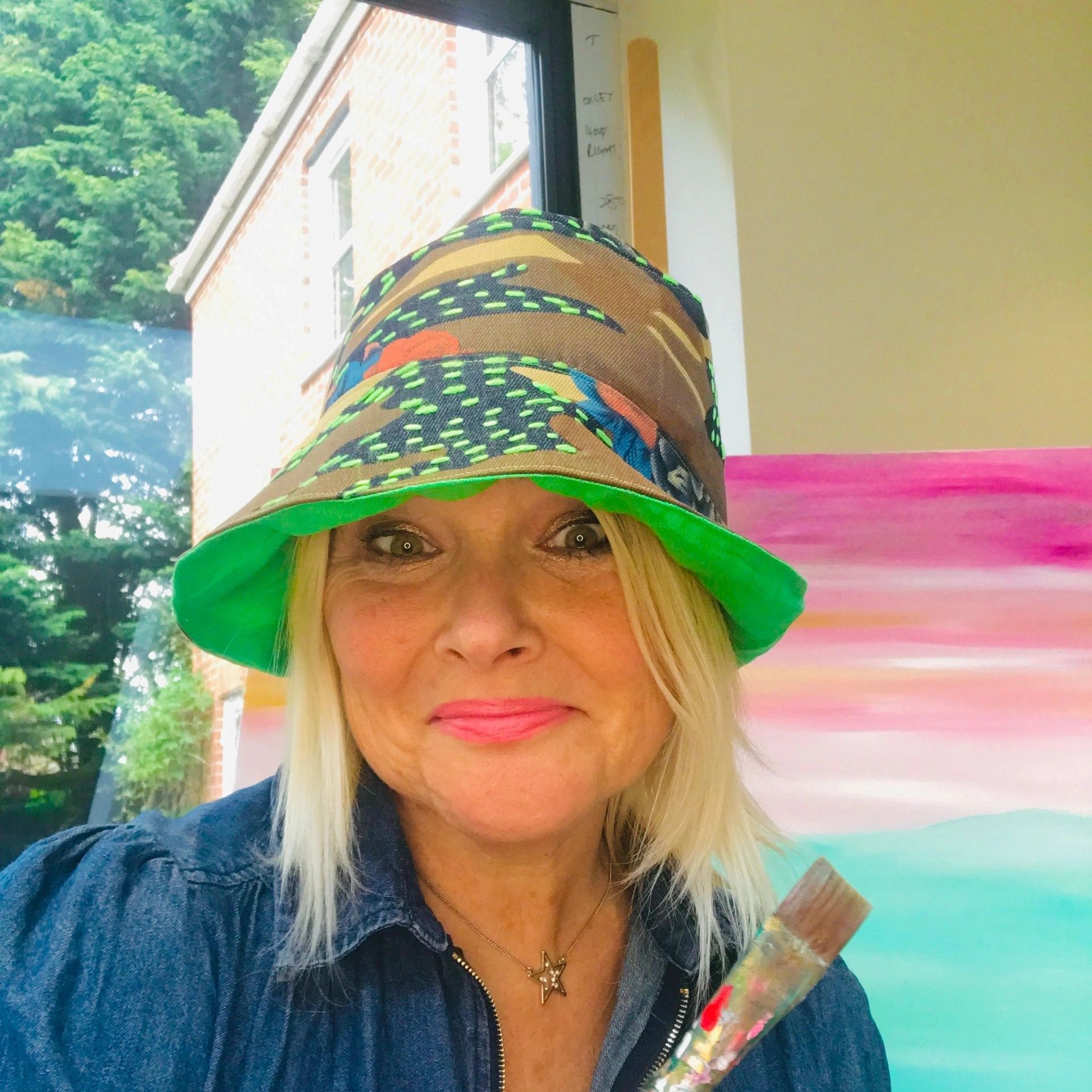 Sara Oxley artist working in her studio 