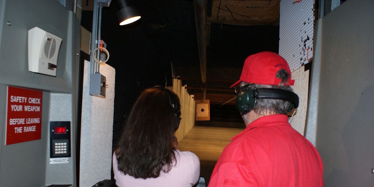 Coaching a student as she shoots her IL Concealed Carry License qualification at the range.