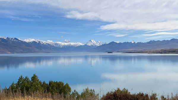 Snow on mountains reflecting on Lake Pukaki, view of Mount Cook, New Zealand