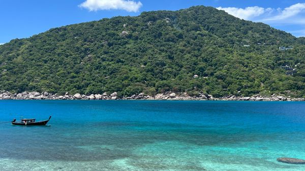 Boat on turquoise water near Koh Nang Yuan, Koh Tao, Thailand