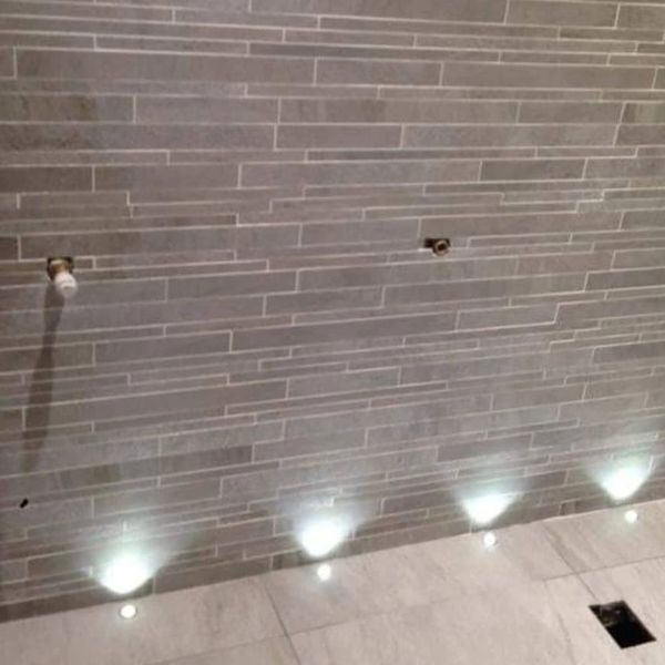 Up lighting installed into the floor in a wet room.