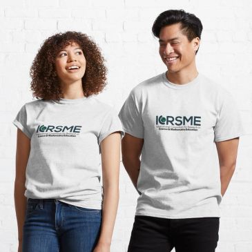 Two people wearing white ICRSME t-shirts smiling and standing against a white wall.