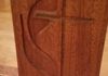 router-carved Methodist logo detail