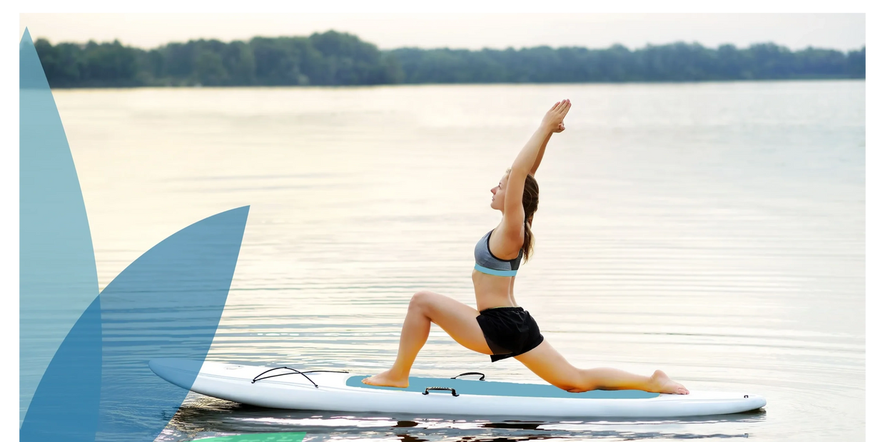 A woman practices yoga on a paddleboard, performing a lunge pose on calm water.