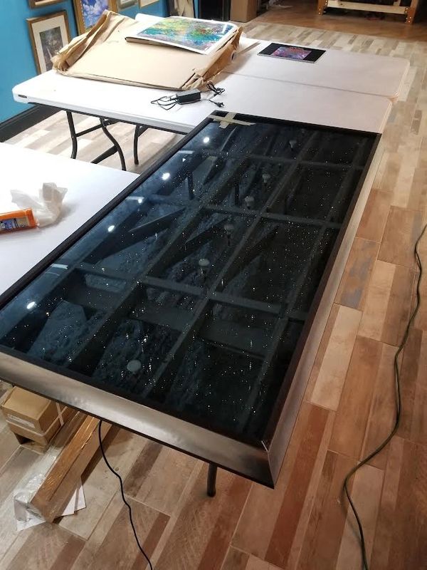 Infinity coffee table glass. I etched real galaxies into the mirror in the back. 