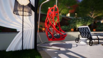 Red hanging chair in a backyard patio at sunset.