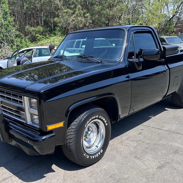 Just washed and waxed older black Chevy truck