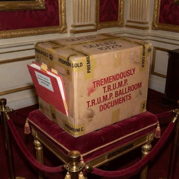 A large box labeled with "Tremendously T.R.U.M.P. Ballroom Documents" on a velvet cushion.