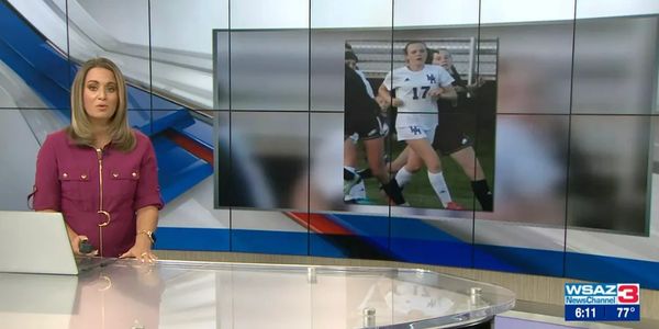News anchor presenting a sports segment with a soccer player image.
