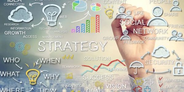 Hand drawing a business strategy with icons and keywords for growth and success.