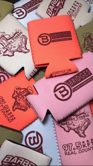 Colorful custom can coolers with branded logos.