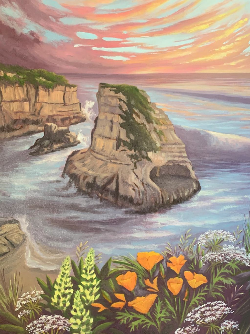 Painting of rocky cliffs and ocean with a colorful sky.