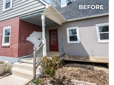 Old house exterior with mixed brick and stucco walls.