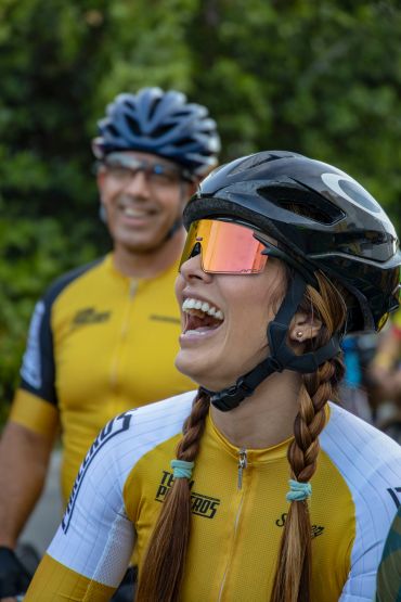 Cyclists enjoying a moment of laughter.