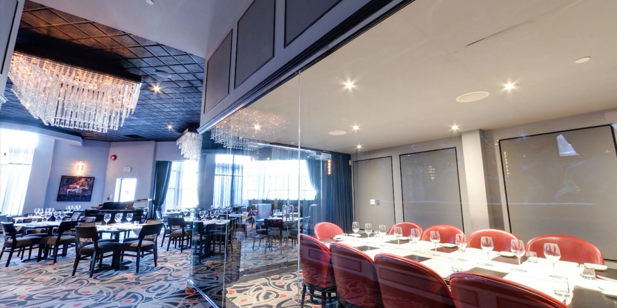 Luxurious restaurant dining area with elegant chandeliers.