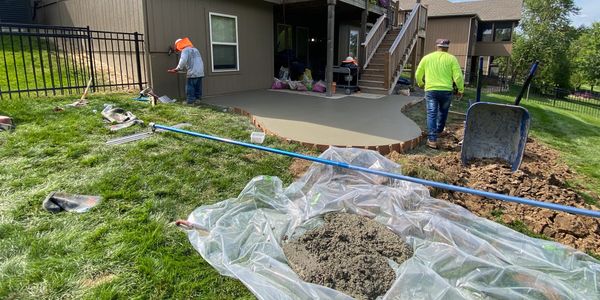 Guys finishing up patio