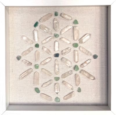 Framed crystal grid artwork featuring clear quartz & green aventurine on a natural linen background