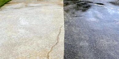 A driveway half cleaned and half dirty, showing a clear contrast.