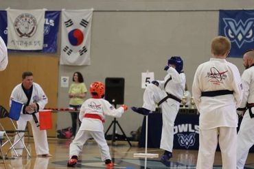 Two young karate / Tang Soo Do students sparring