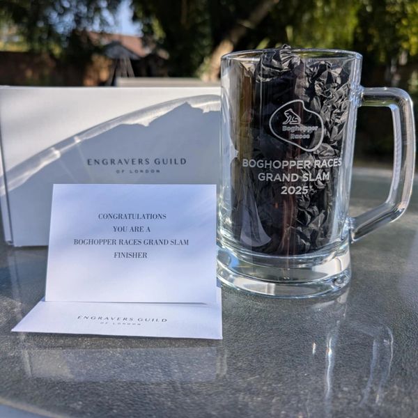 Engraved glass mug and congratulatory card for Boghopper Races Grand Slam 2025 finisher.