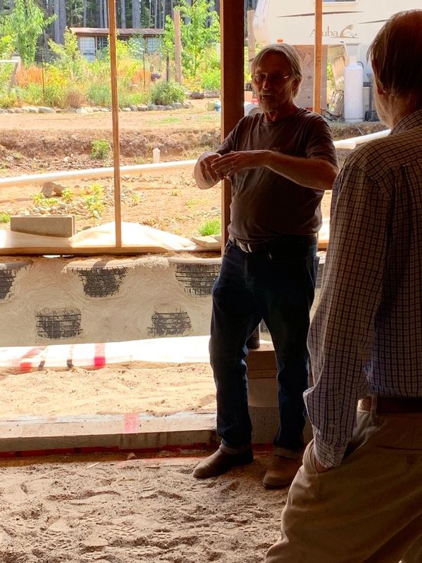 Tony, Earthship builder, answering questions during our 3rd annual open house in 2021.  No tour was 
