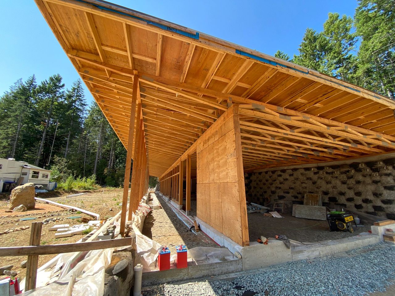East face of theDoighouse Earthship. On the left the greenhouse, on the right is the learning centre space. East face of theDoighouse Earthship. On the left the greenhouse, on the right is the learning centre space.