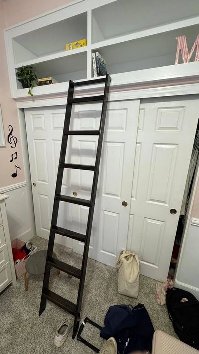 Custom Inset bookshelf above closet with Ladder.