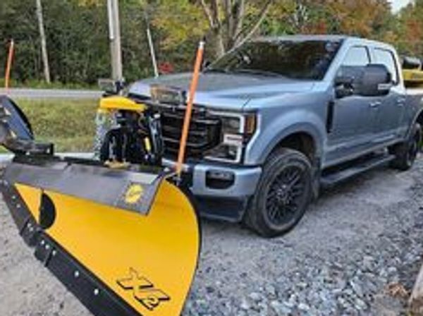 Ford’s F-350 4x4 Powerstroke fitted with a 9’6” Fisher XV2 plow and a matching 1.5 yard Polycaster 