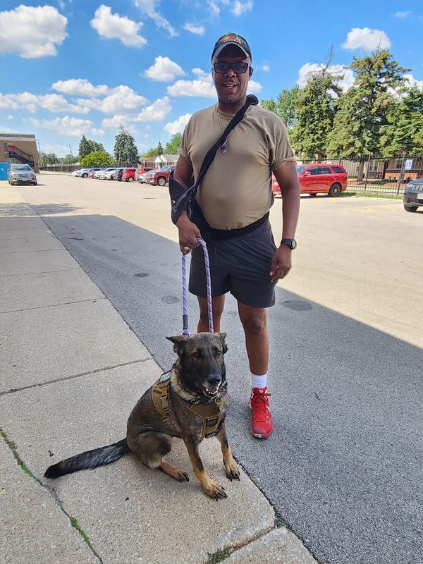 Veteran Terry Smith and service pooch Sadie who are thankful for our supplies and assistance!