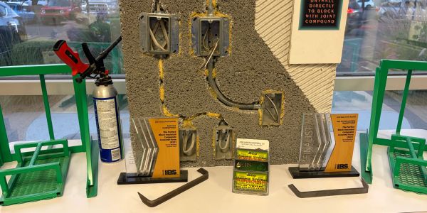 Electrical outlet installation demonstration with awards.
