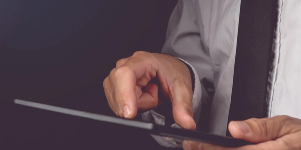 Man reviewing his data on a tablet
