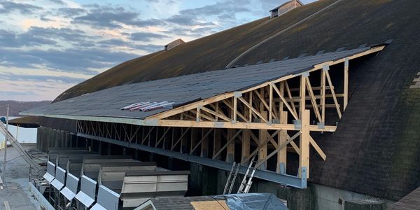 Commercial construction of an extended roof for supply protection from weather on Lake Barkley, KY.