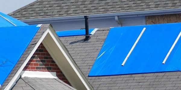 24/7 Emergency tarp & board up services due to falling tree limbs, windblown debris or leaking roof.