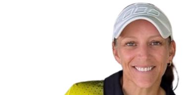 Smiling woman wearing a white cap.
