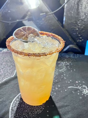 Spicy margarita with tajin and salt rim. Using dried fruit allows us to reduce waste while showcasin