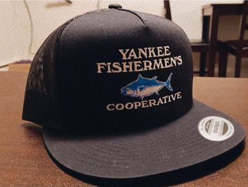 Black trucker hat with "Yankee Fishermens Cooperative" and shark logo.