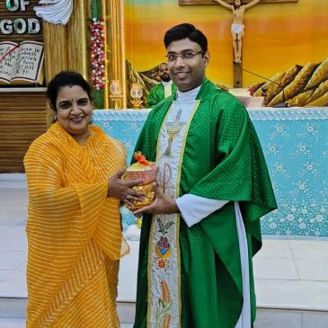 Woman presenting gift to priest in church.