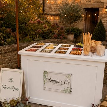 Elegant charcuterie cart set up for an event in the beautiful Cotswolds .