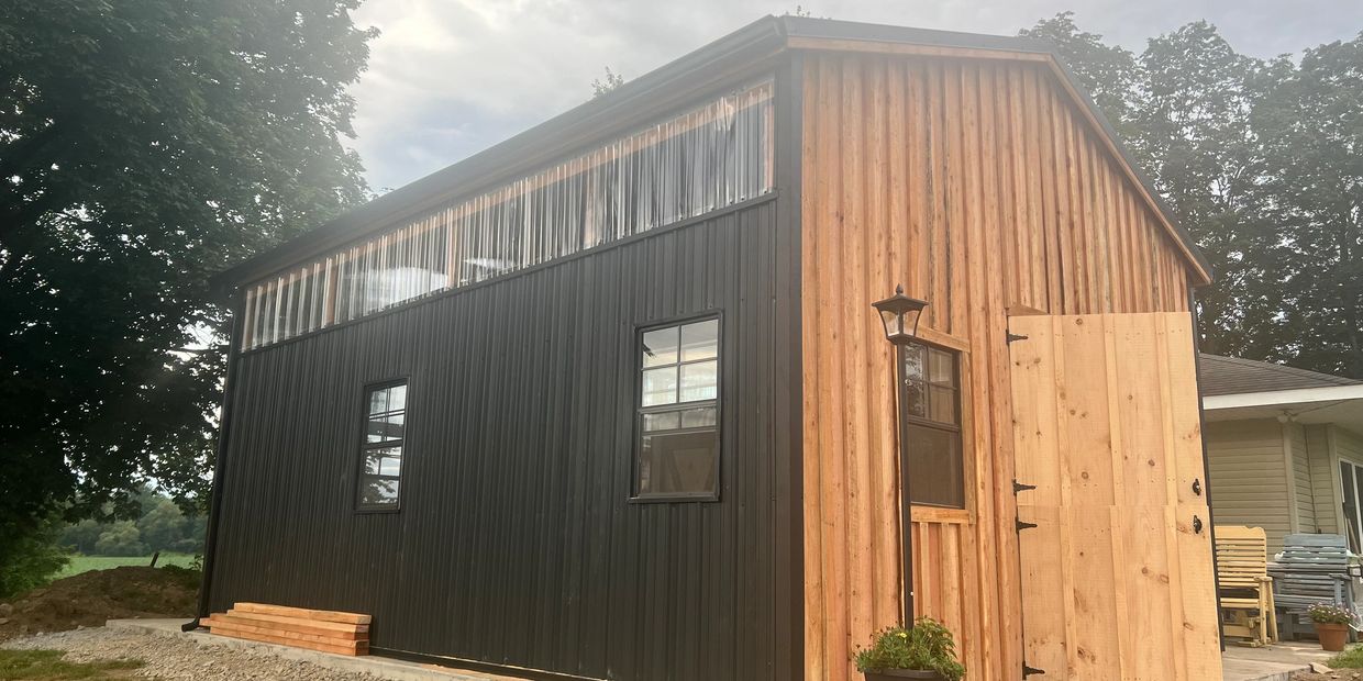 custom shed built on site. two stories with windows
