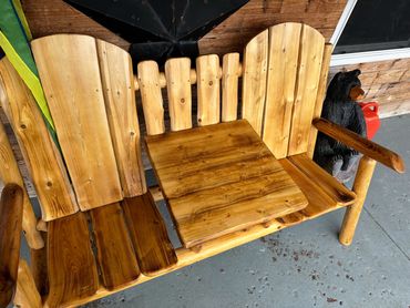 double custom wooden bench/chairs on a porch