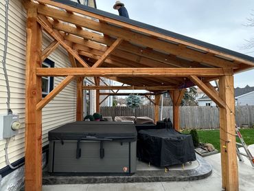 a work in progress lean to covering a hot tub in the back yard